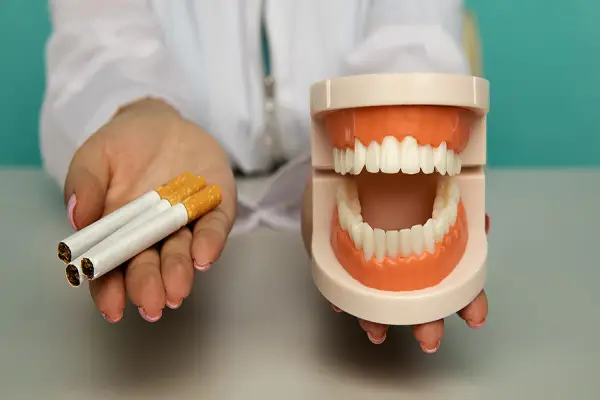 Cigarettes and tooth replicas