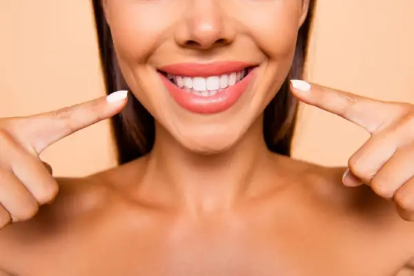 a woman showing her tooth